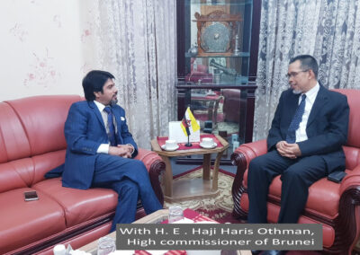 With H. E . Haji Haris Othman, high commissioner of Brunei